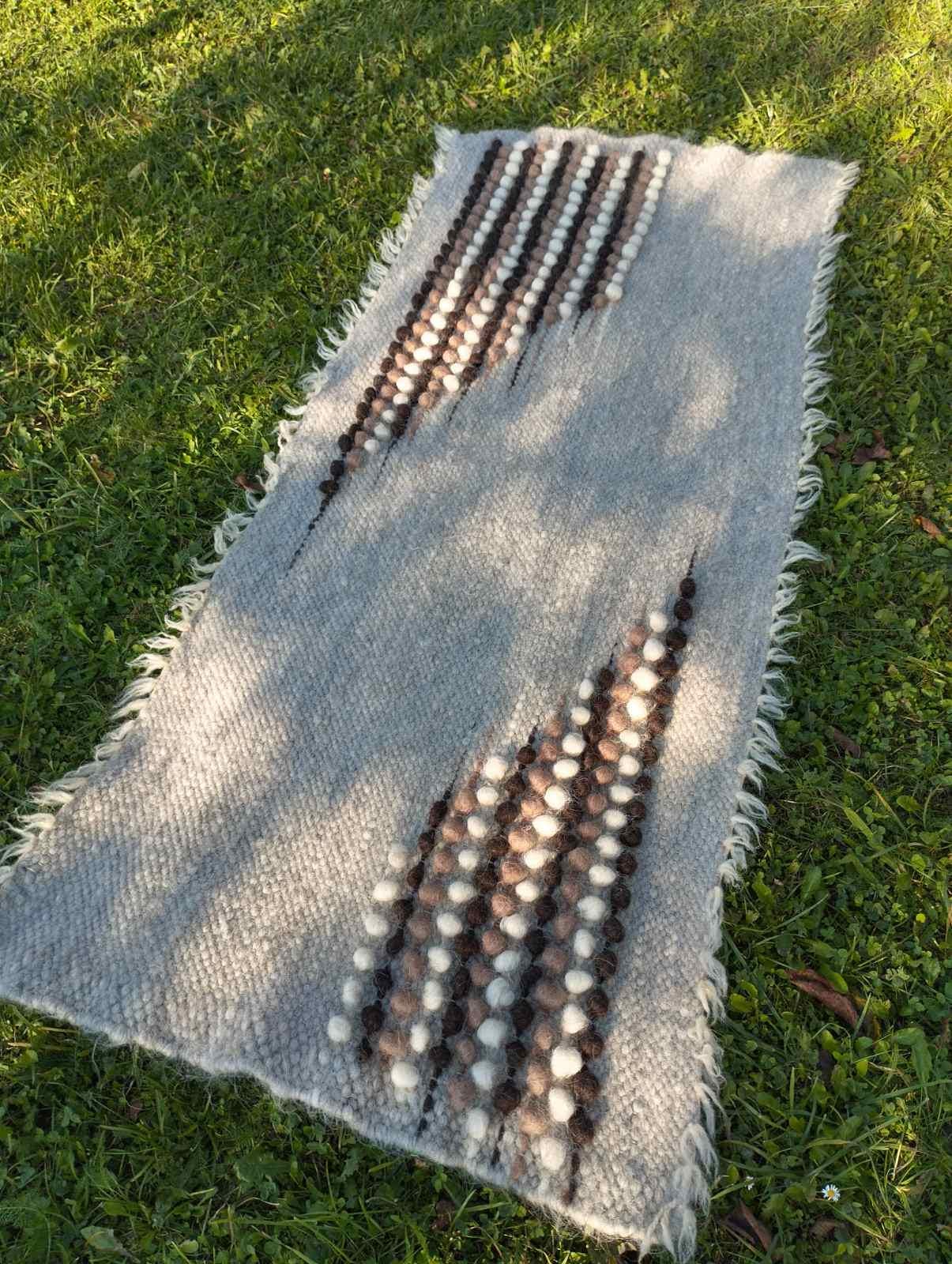 Artisan wool rug reflecting in water, highlighting its natural fibers and eco-friendly craftsmanship for modern living.